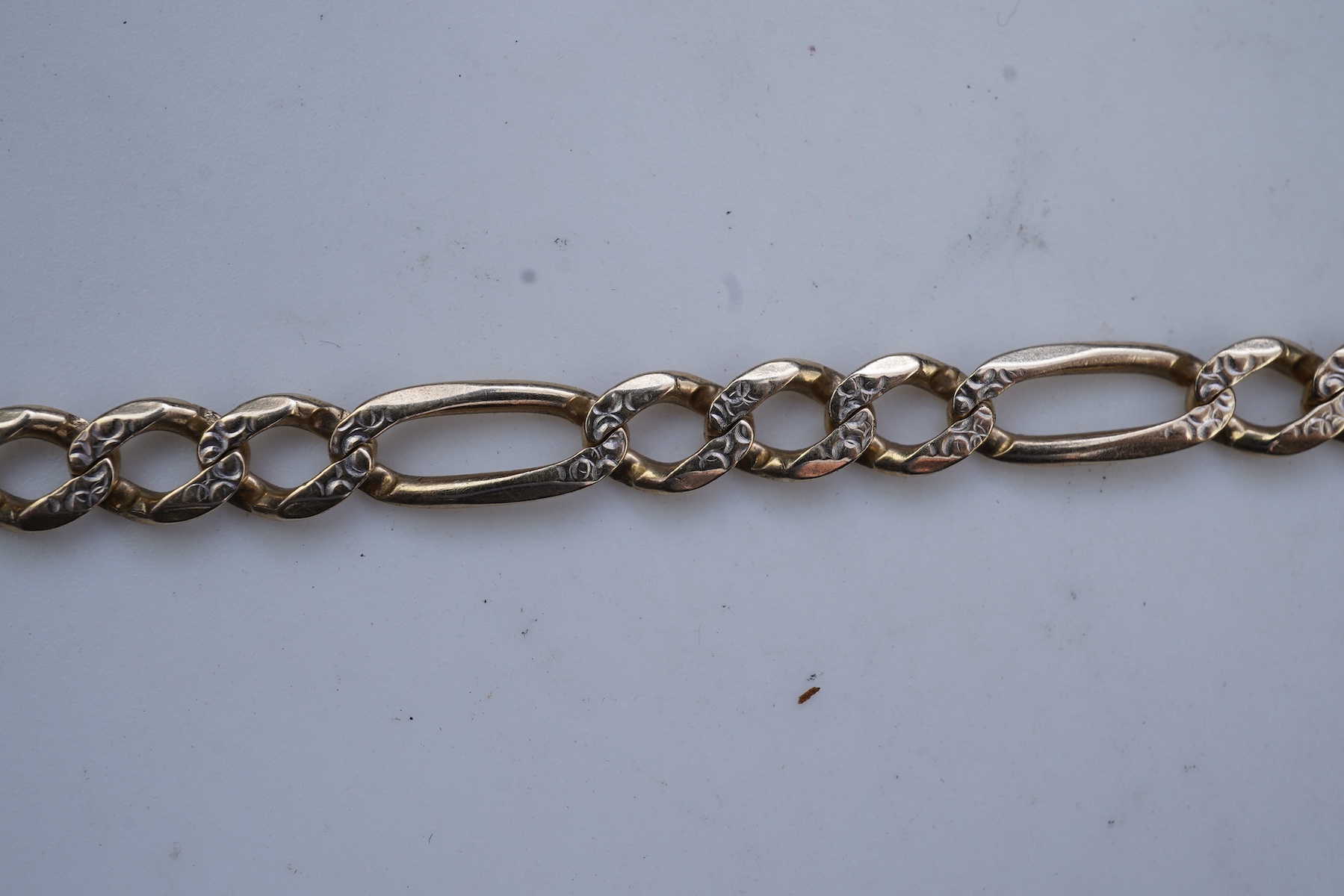 Two gold bracelets and a gold watch